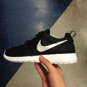 Black nike shoes with white swoosh